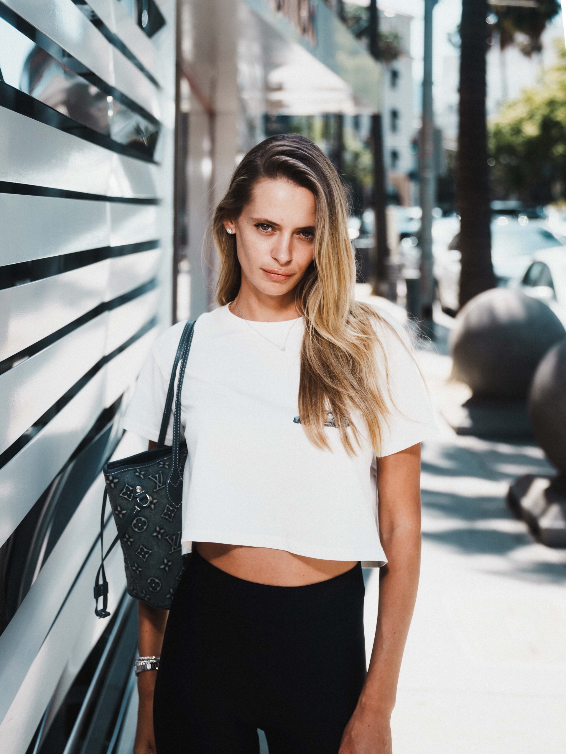 Evelyn Rose holding Louis Vuitton handbag posing on Rodeo Drive Beverly Hills