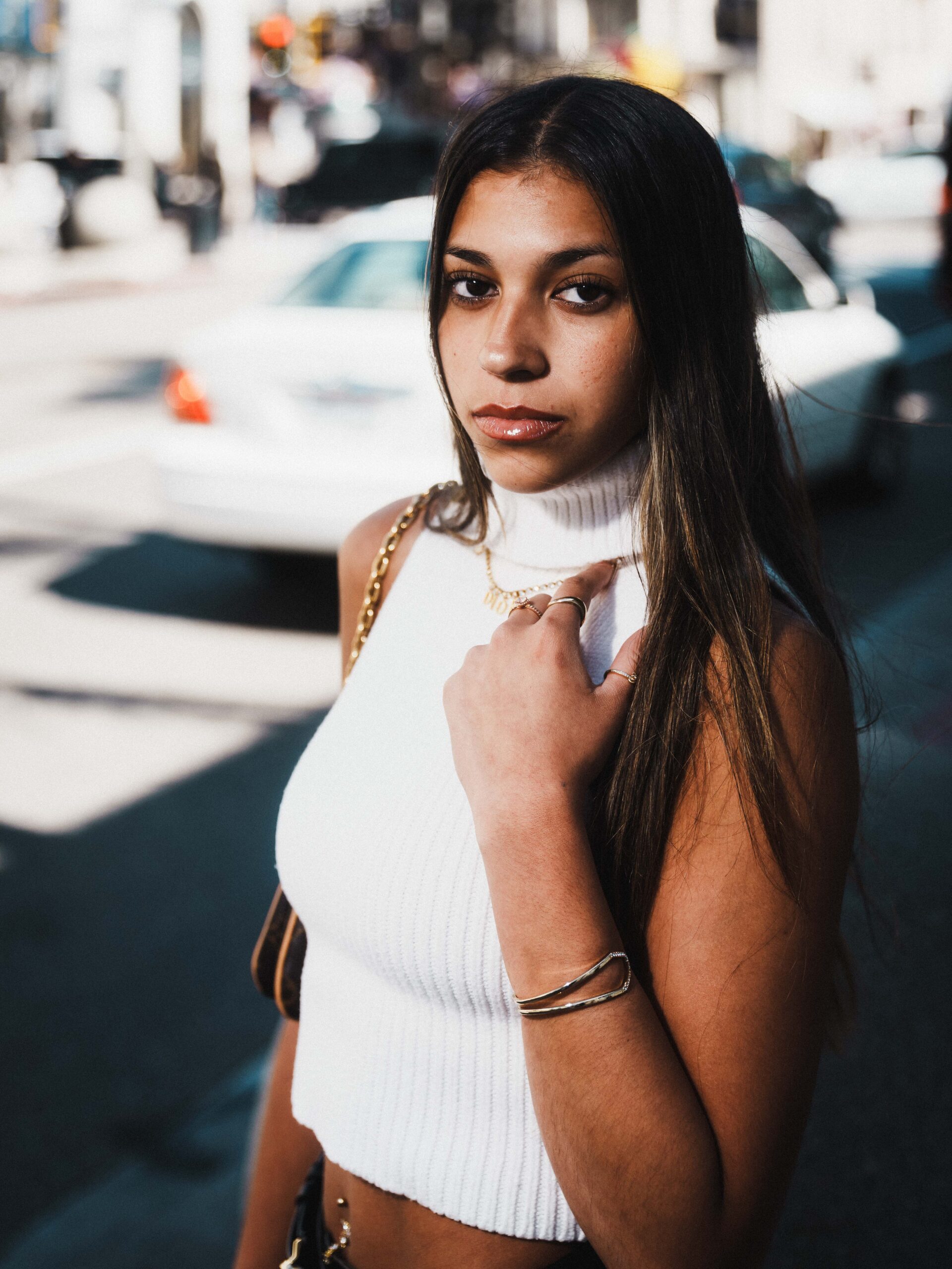 Detailed fashion portrait highlighting jewelry and styling elements, captured in luxury editorial photography style on Rodeo Drive.